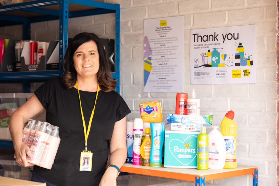 The Hygiene Bank - woman holding hygiene products