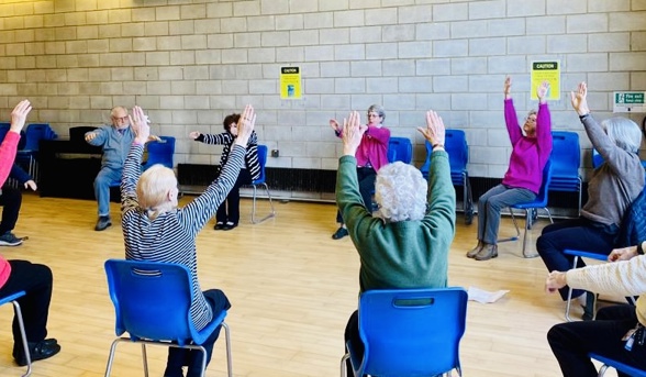 Women doing chair exercises 