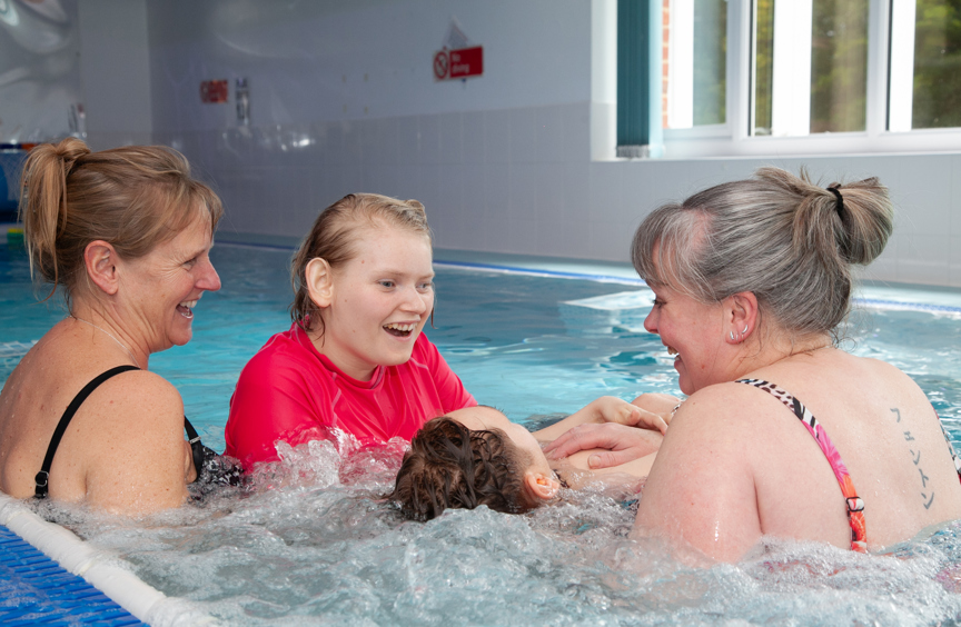 Young people enjoying a swimming session