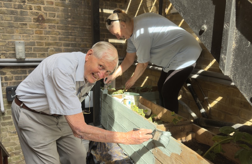 Man and woman painting